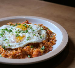 a-plate-of-food-on-a-wooden-table.jpg a plate of food on a wooden table
