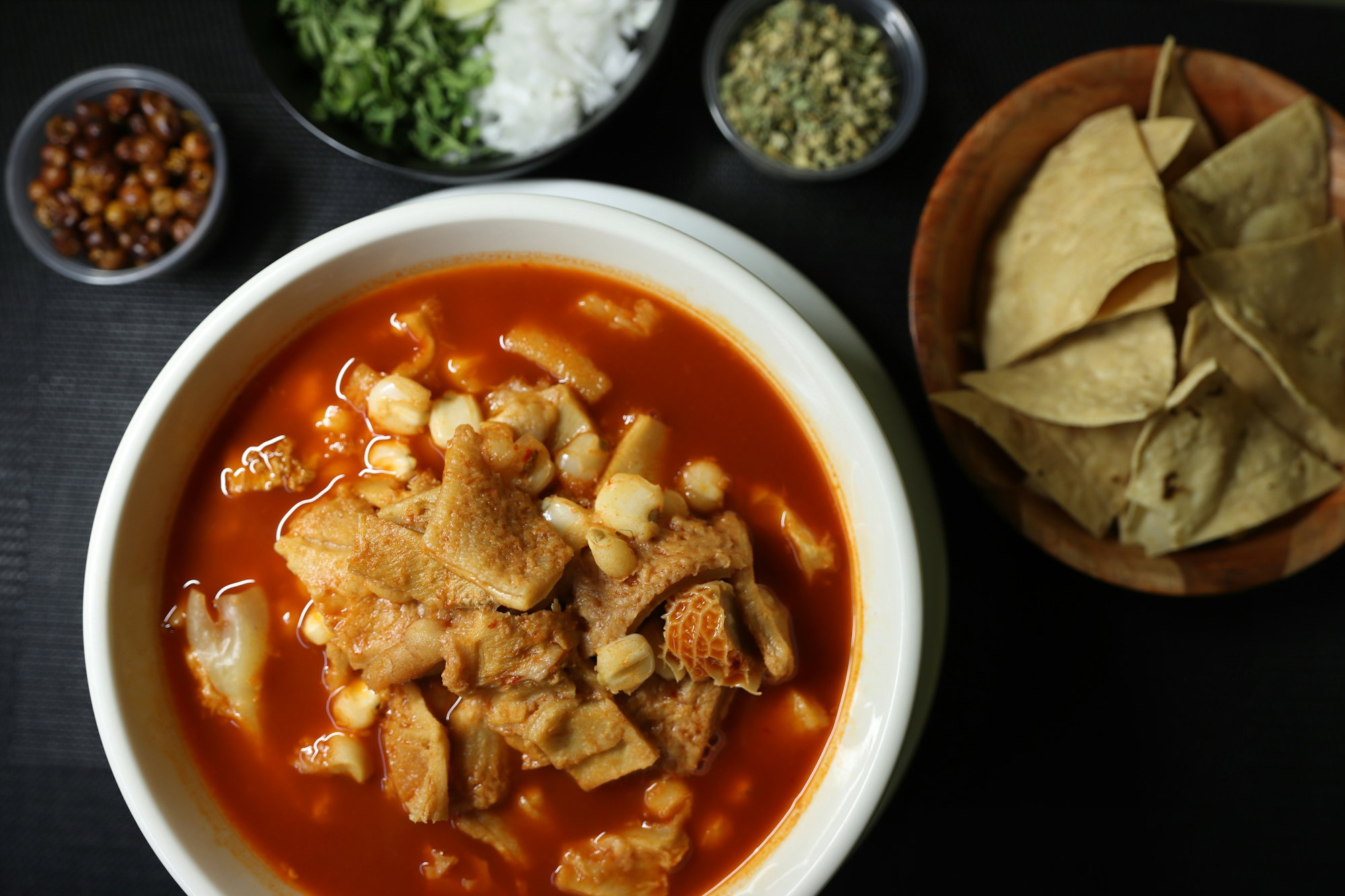 a-bowl-of-soup-with-tortilla-chips-and-salsa.jpg A bowl of soup with tortilla chips and salsa